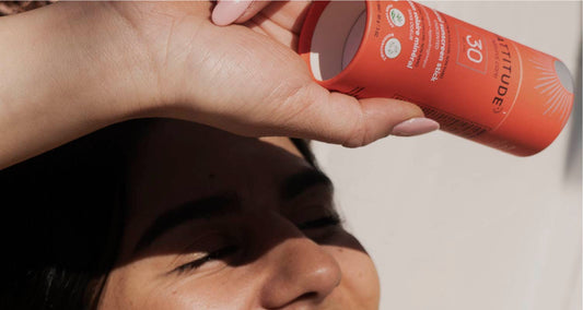 Woman Applying Mineral Sunscreen to Prevent Dry Skin From Sunburn during Winter Sports