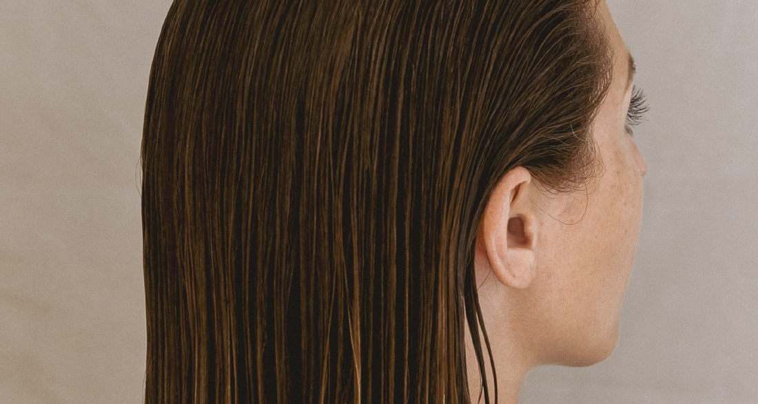 Woman having washed her hair with ATTITUDE leaves bar clay shampoo